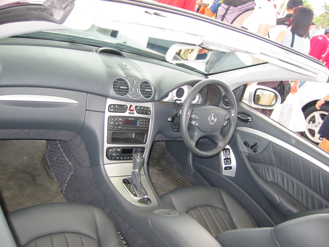 Luxury convertible interior with central console and steering wheel controls