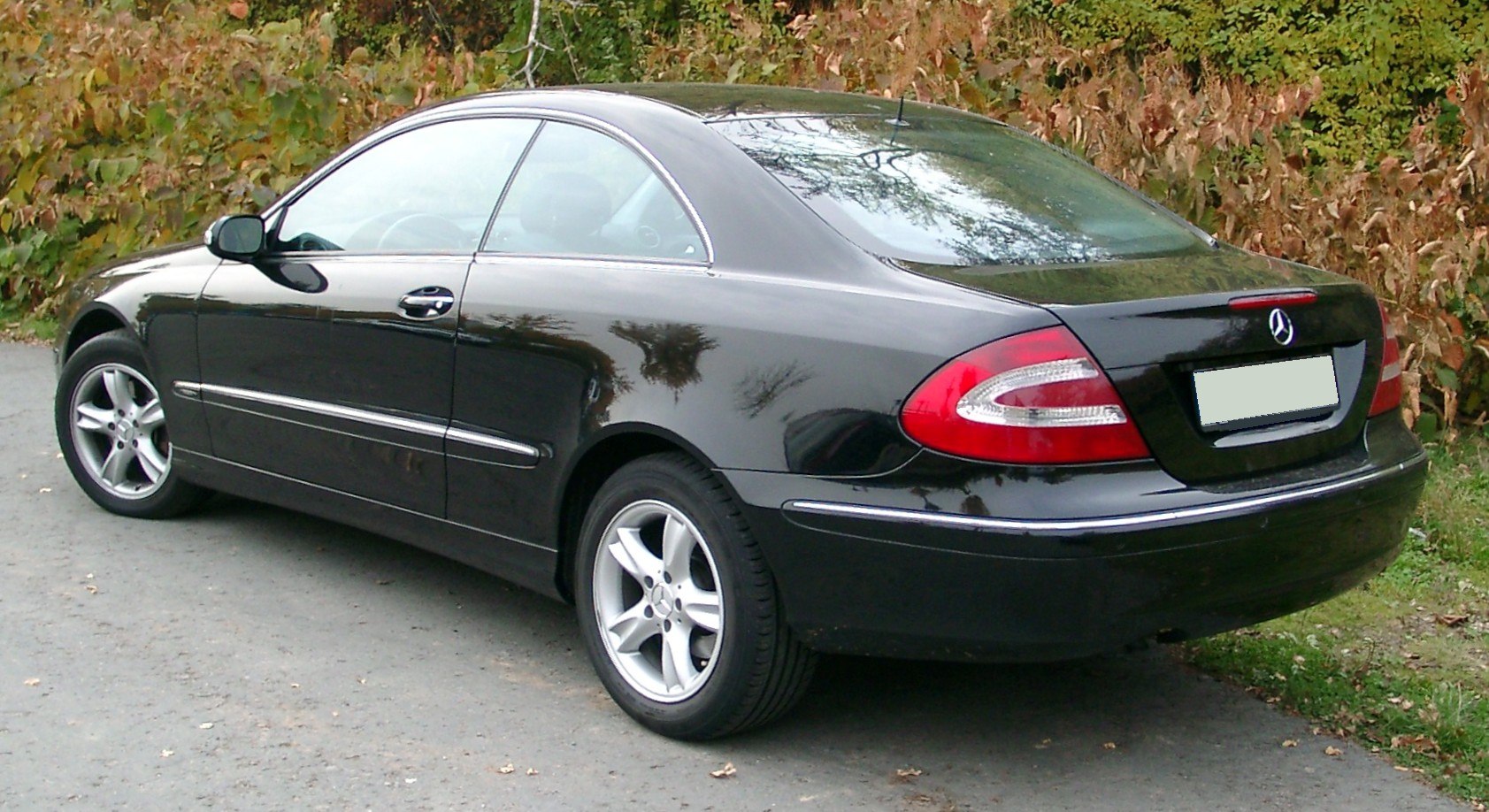 Rear and side profile with distinct tail lights and alloy wheels
