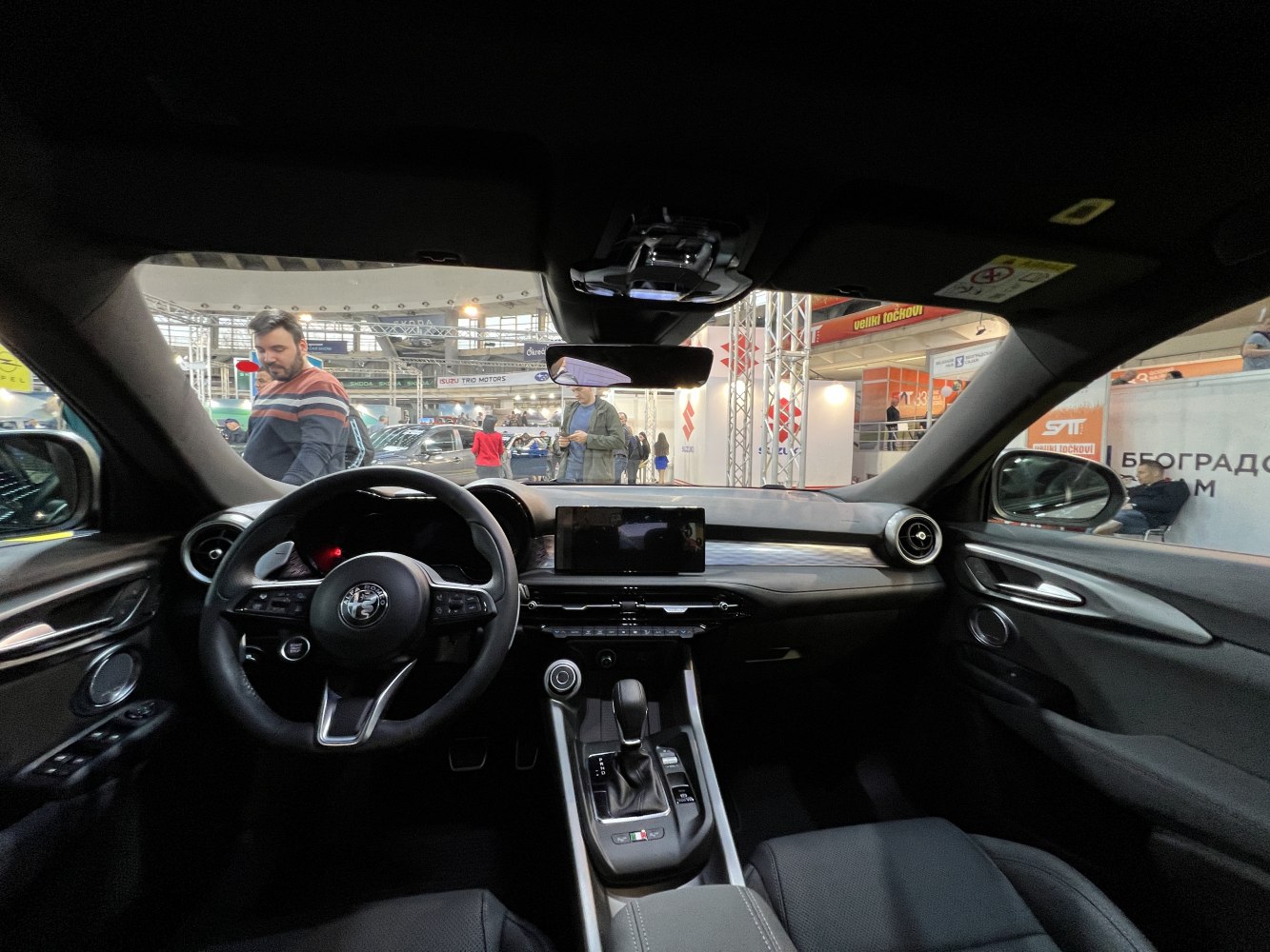 Modern car interior with steering wheel and touchscreen dashboard
