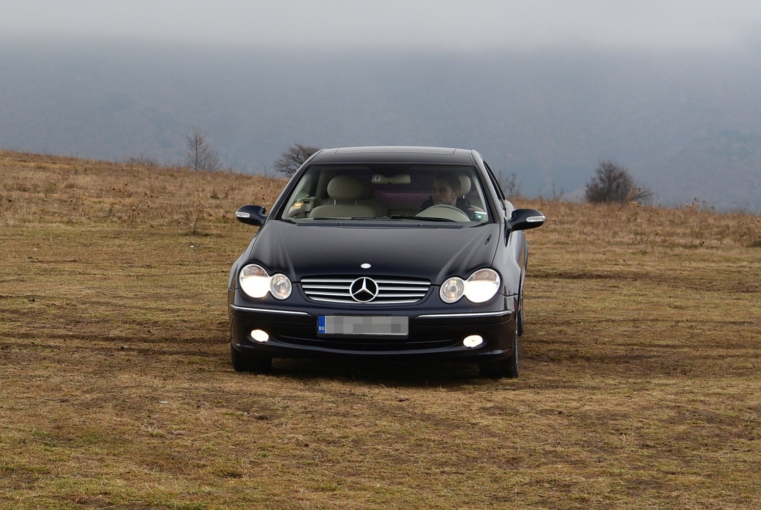 Front view of car with headlights and fog lights on