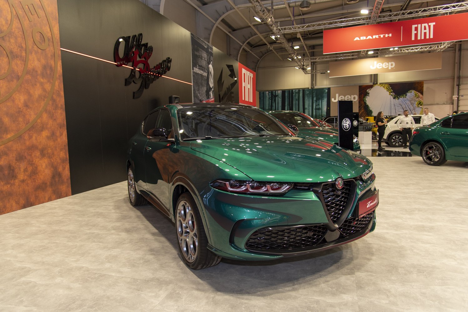 Front view of green SUV with signature grille and slim headlights