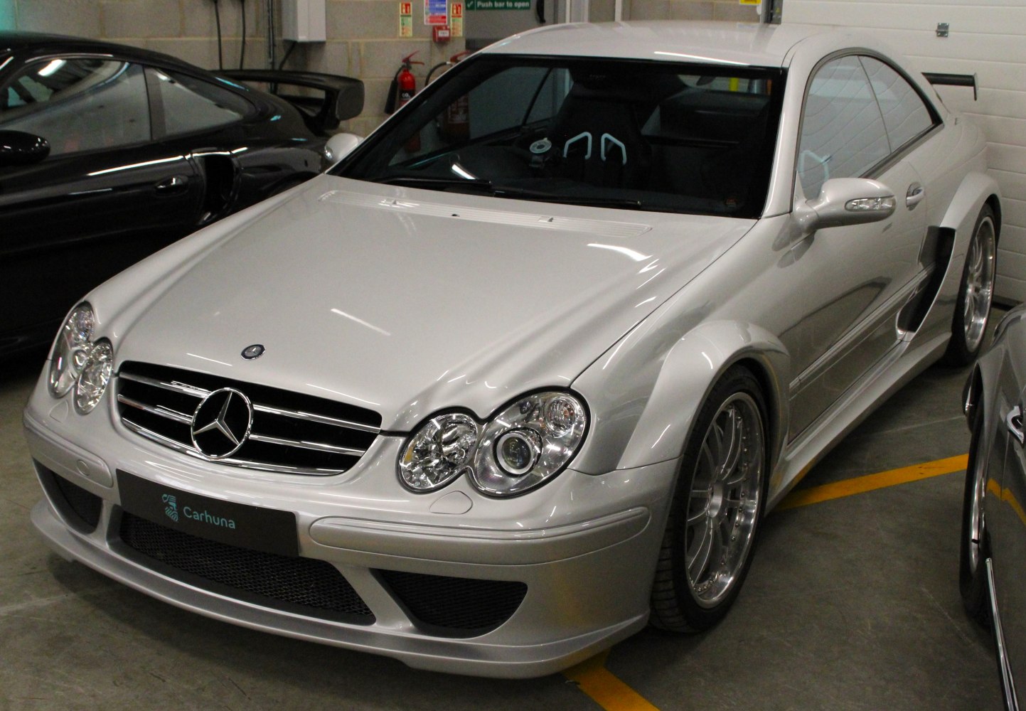 Sporty front view with wide fenders and aerodynamic bumper
