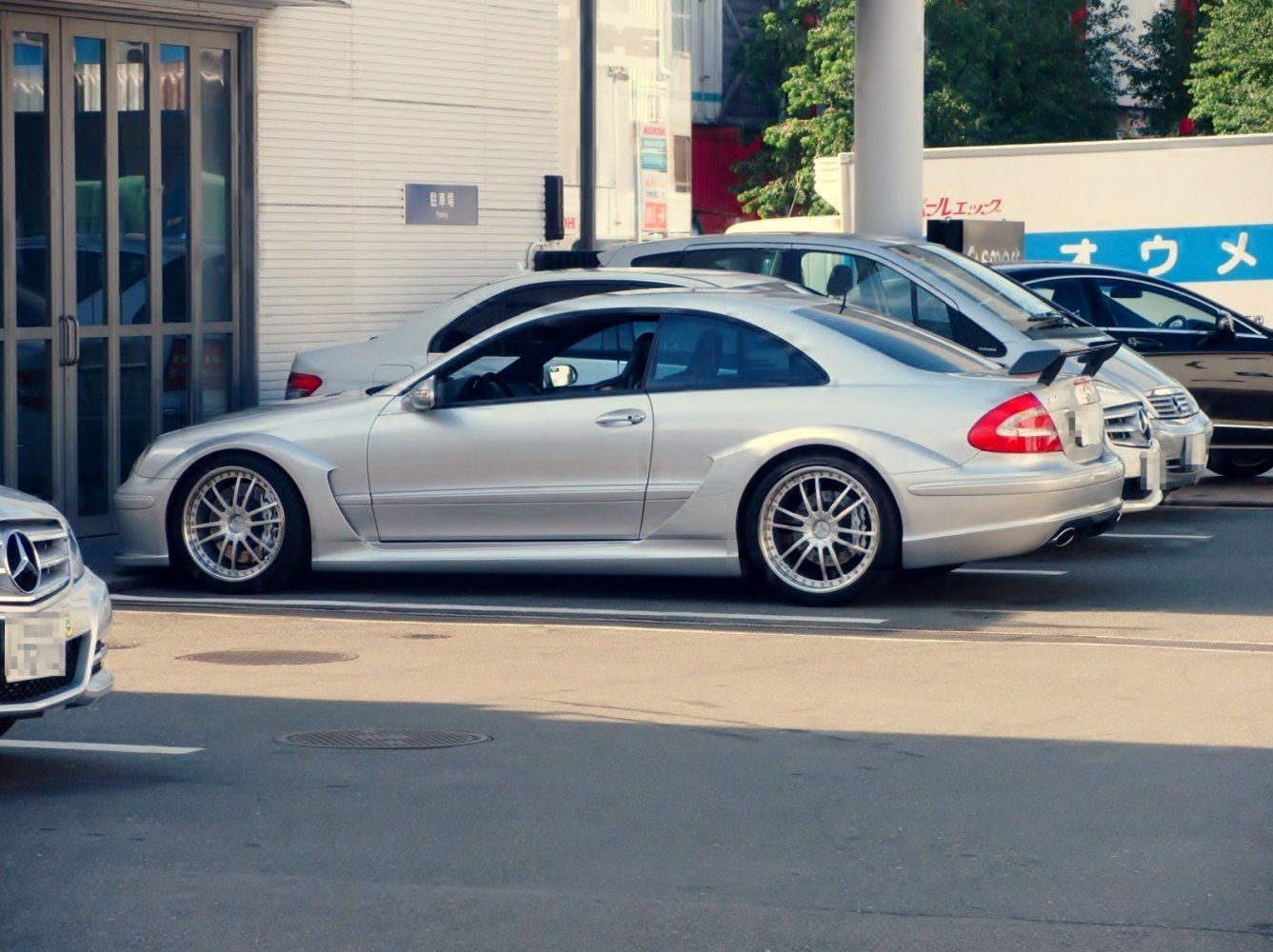 Sporty silver coupe with rear spoiler and multi-spoke wheels