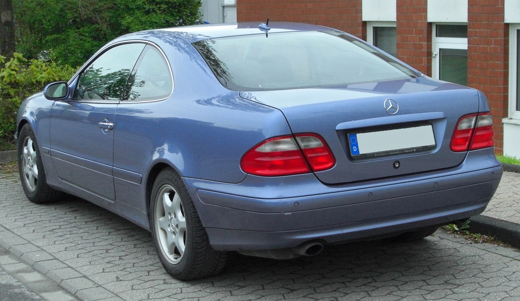 Rear view of a coupe with distinct taillights and smooth body lines
