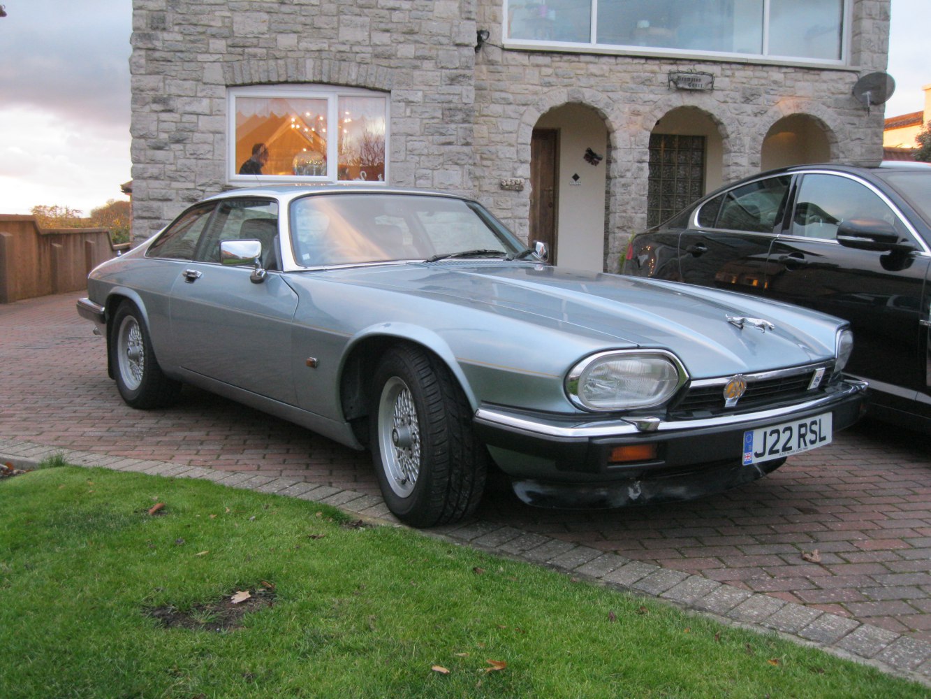 Vintage sports coupe with wire wheels and chrome mirrors