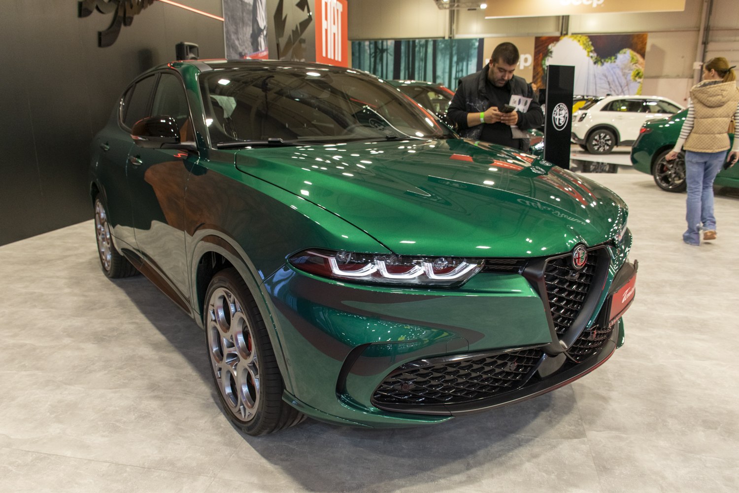 Triple LED headlights and triangular grille on green SUV front