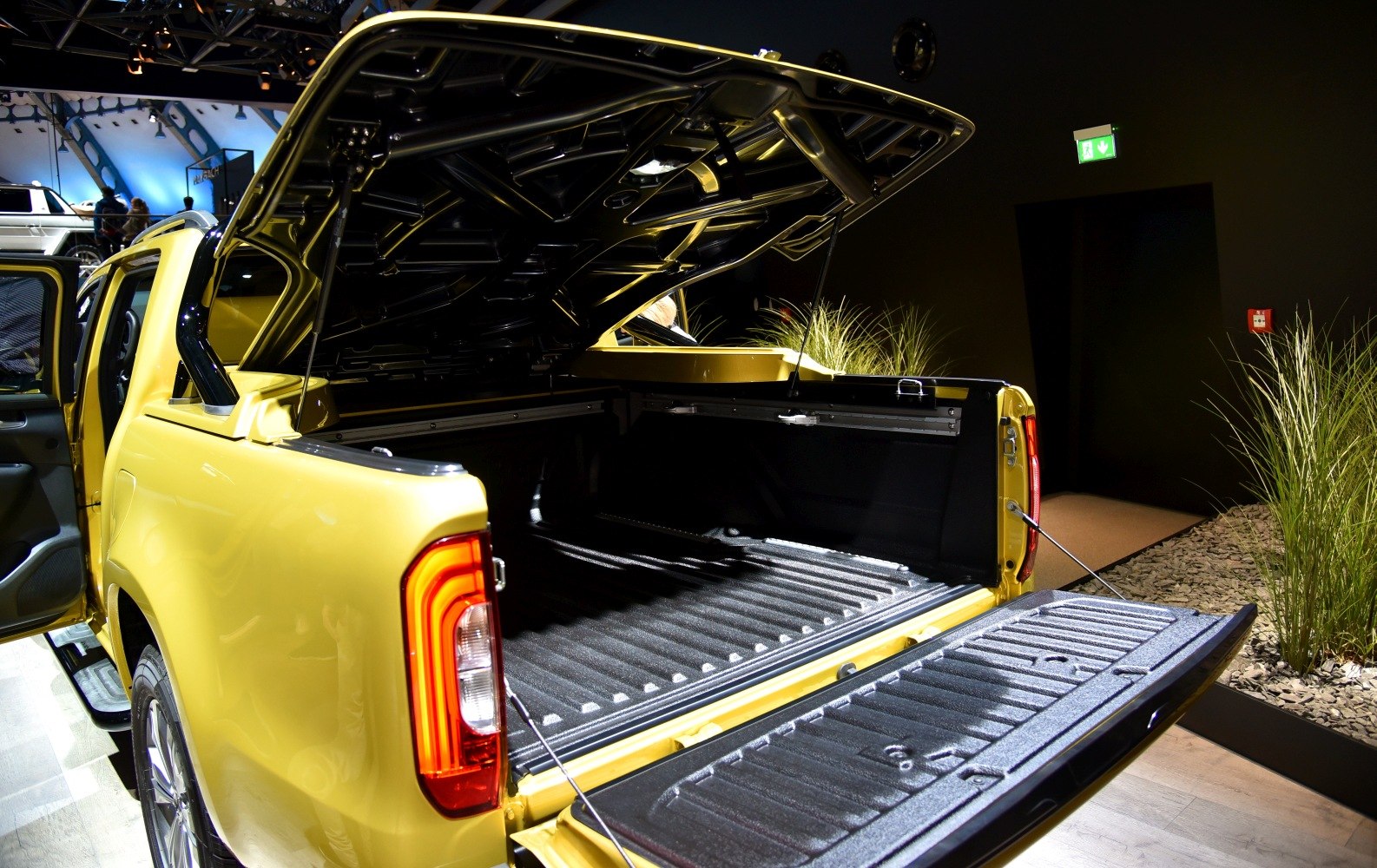 Pickup truck bed with open tailgate and cargo cover