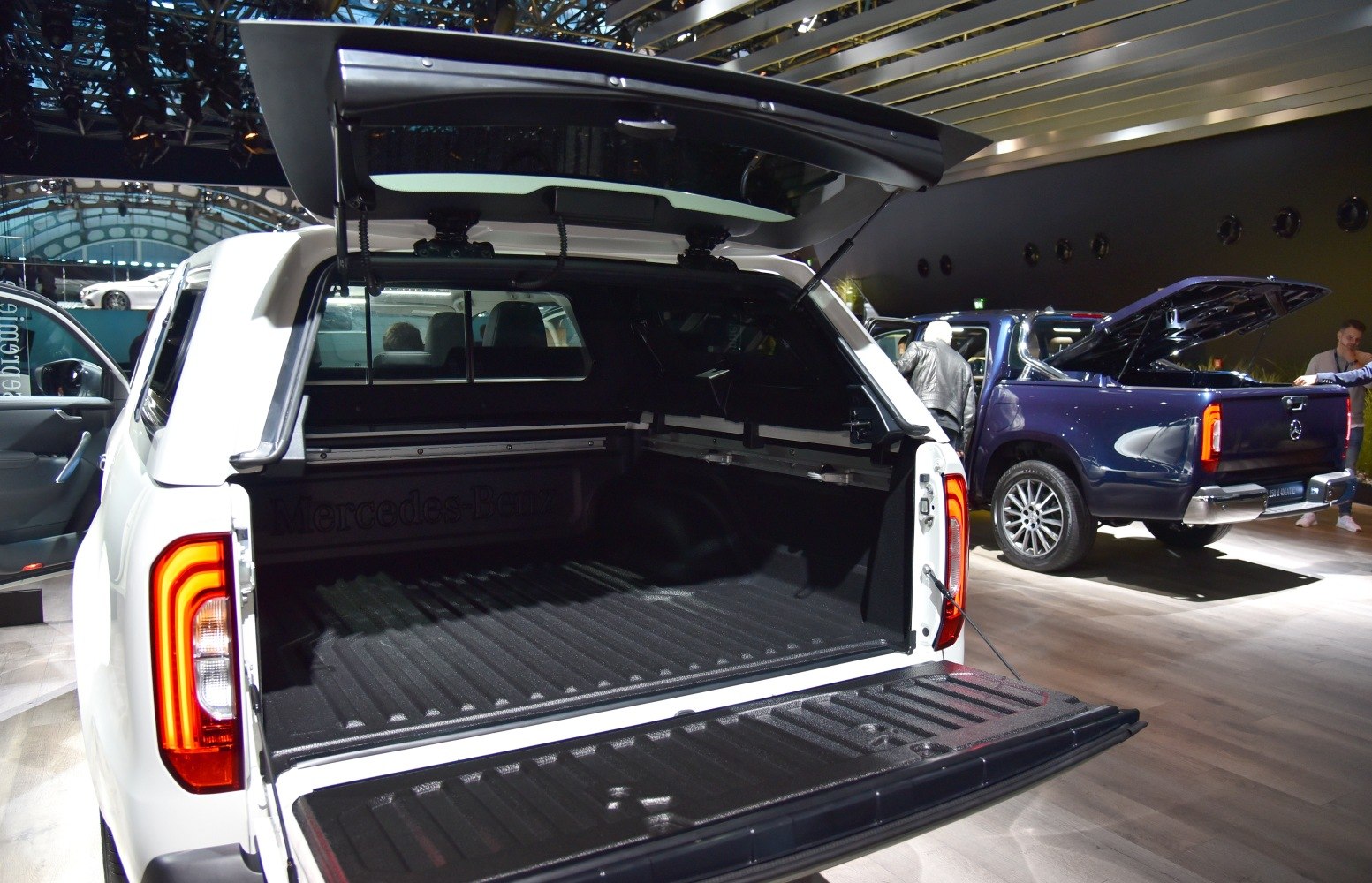 Open rear cargo bed with tailgate and canopy of pickup truck