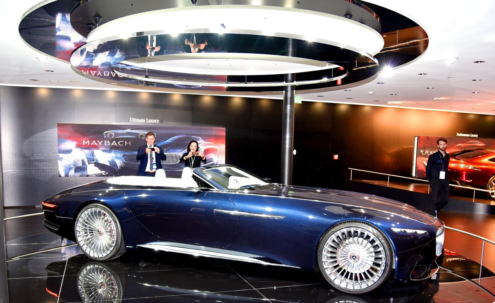 Luxury convertible with multi-spoke wheels and sleek body