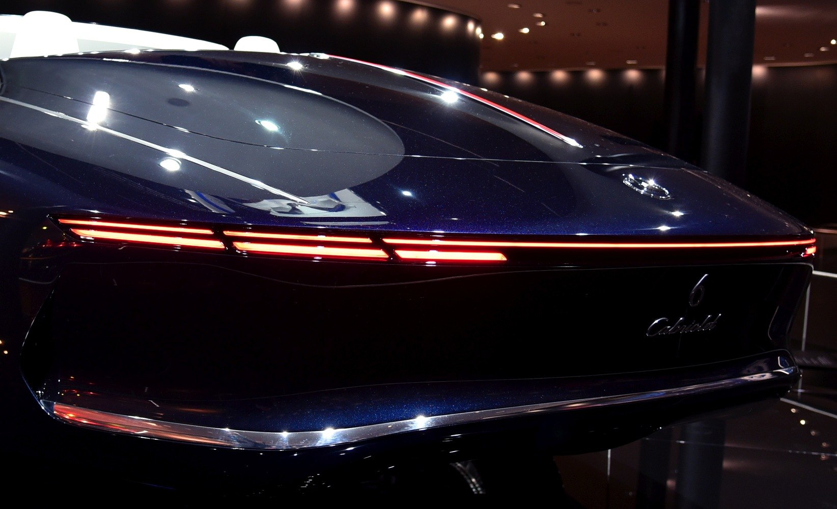Sleek rear end with continuous red LED light strip and smooth, reflective surface