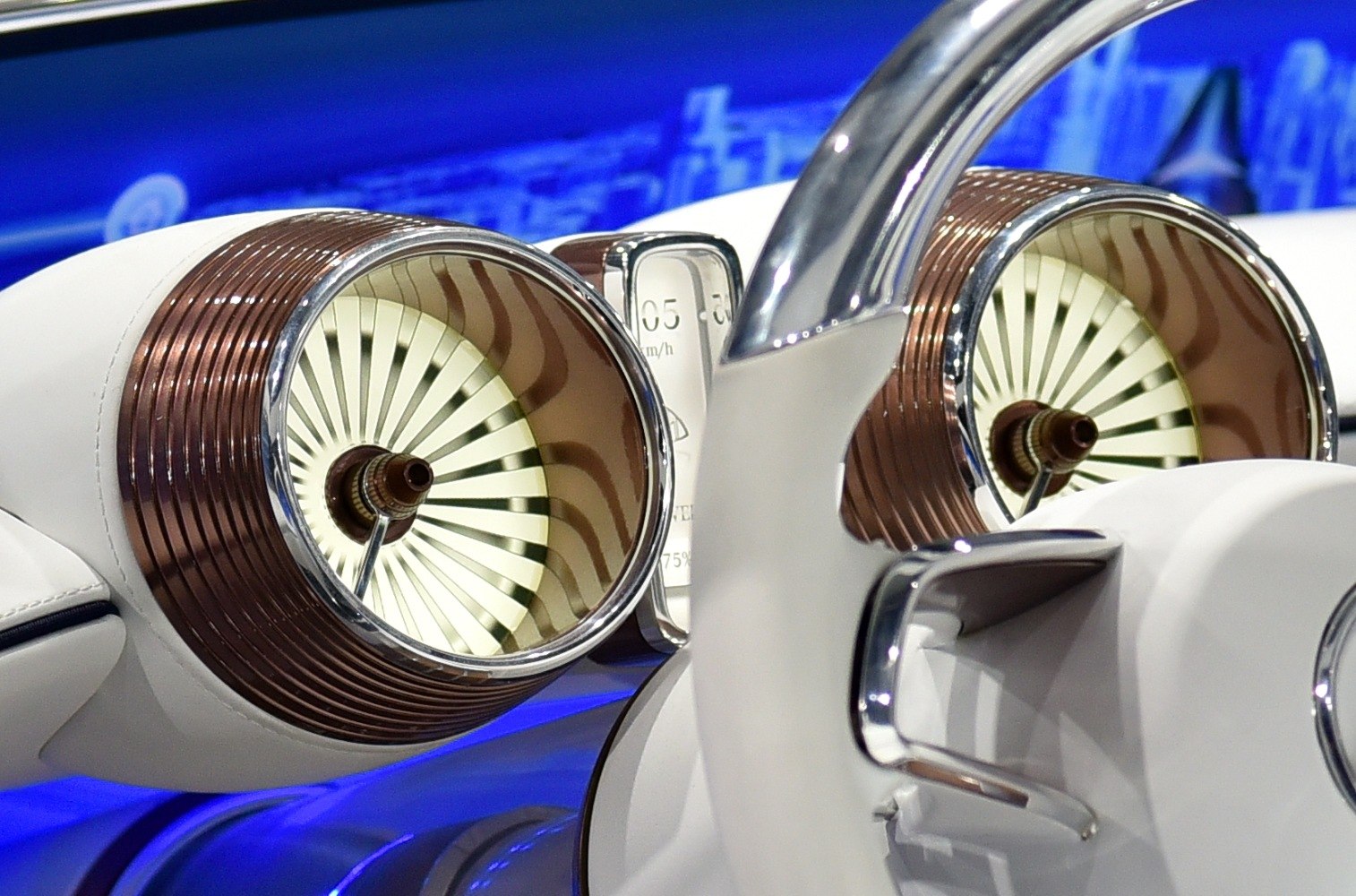 Futuristic instrument cluster with turbine-style air vents and chrome accents