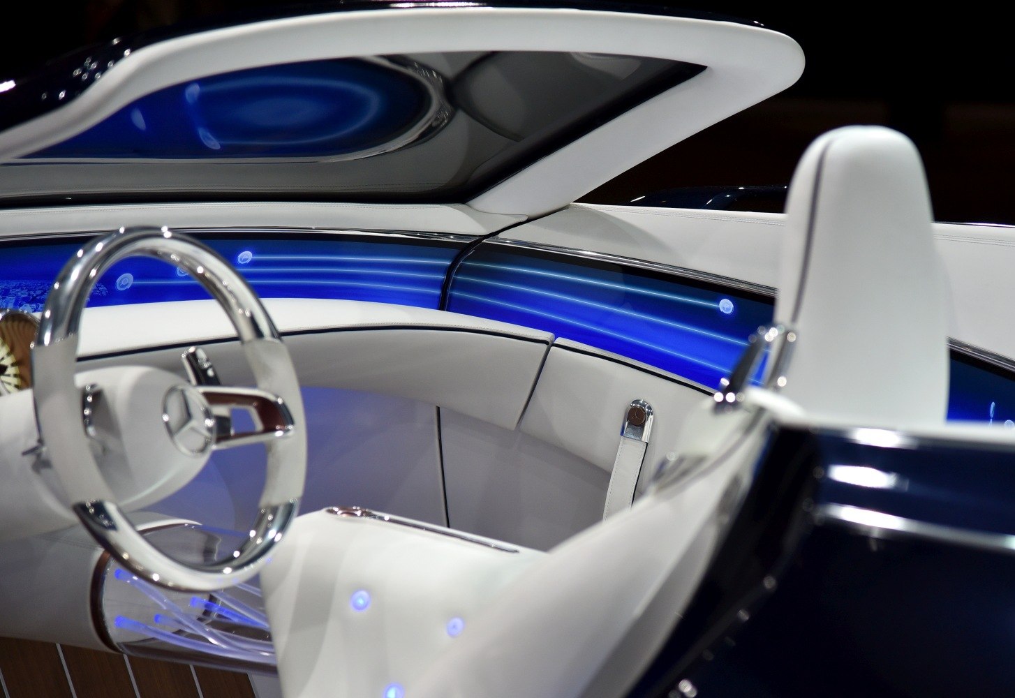 Luxurious white leather interior with illuminated futuristic dashboard
