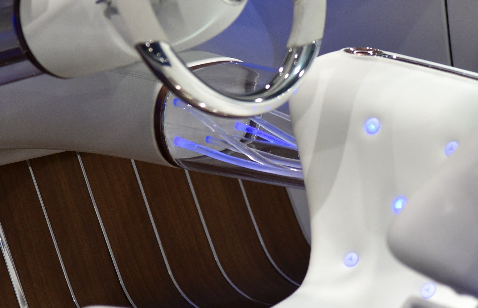 Illuminated steering column and wooden floor detailing with blue LED lighting