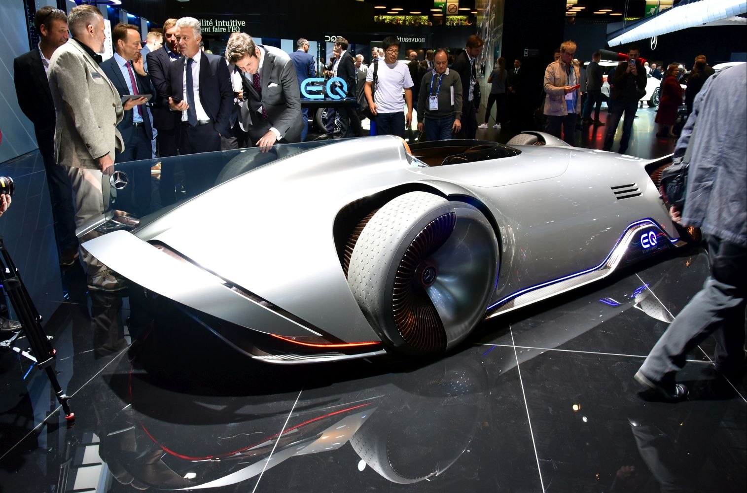 Sleek aerodynamic electric concept car with distinctive wheel covers.