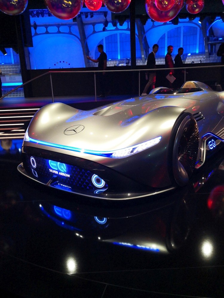 Futuristic silver aerodynamic race car with advanced LED lighting