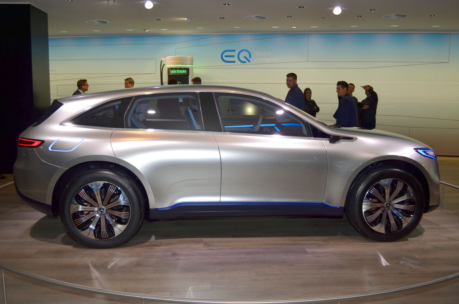 Side profile of electric SUV with blue illuminated accents and aerodynamic styling