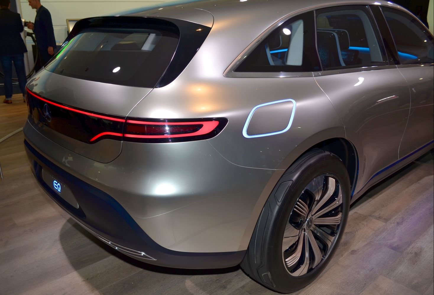 Futuristic rear with LED tail light bar, illuminated fuel cap, and stylish alloy wheels.
