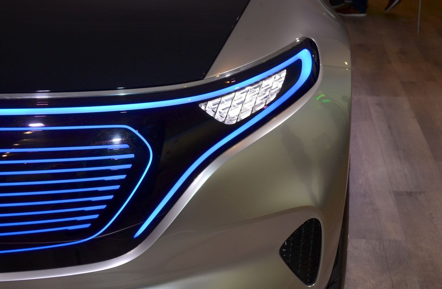 Futuristic LED headlights and illuminated grille with blue accents
