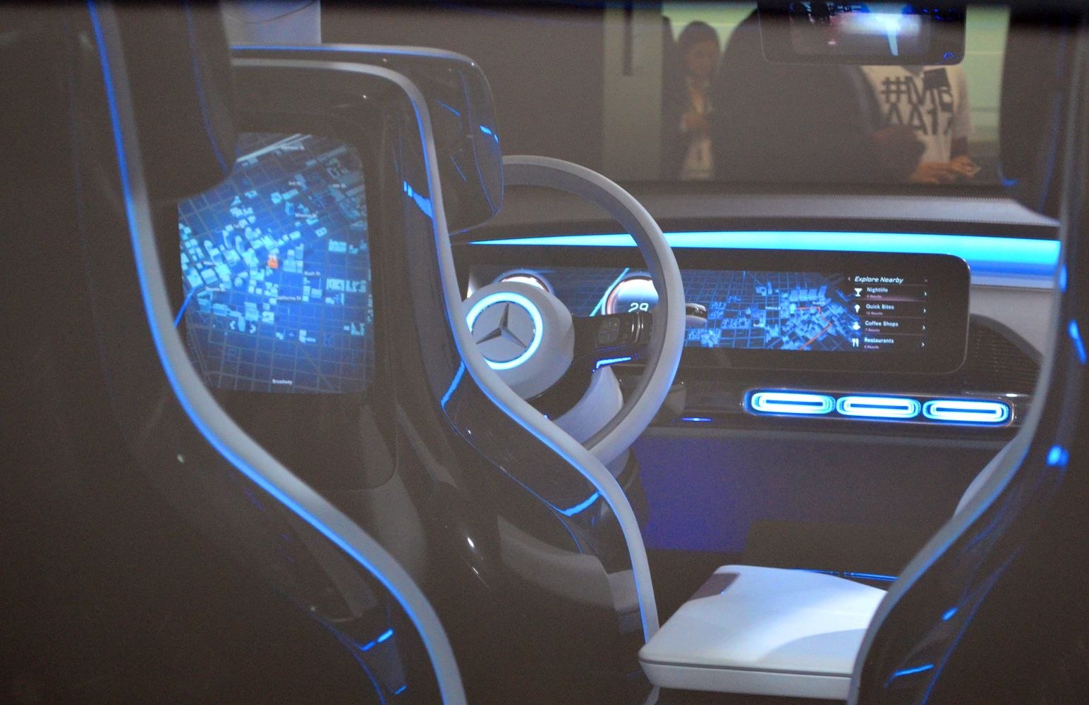 Futuristic car interior with digital displays and blue ambient lighting