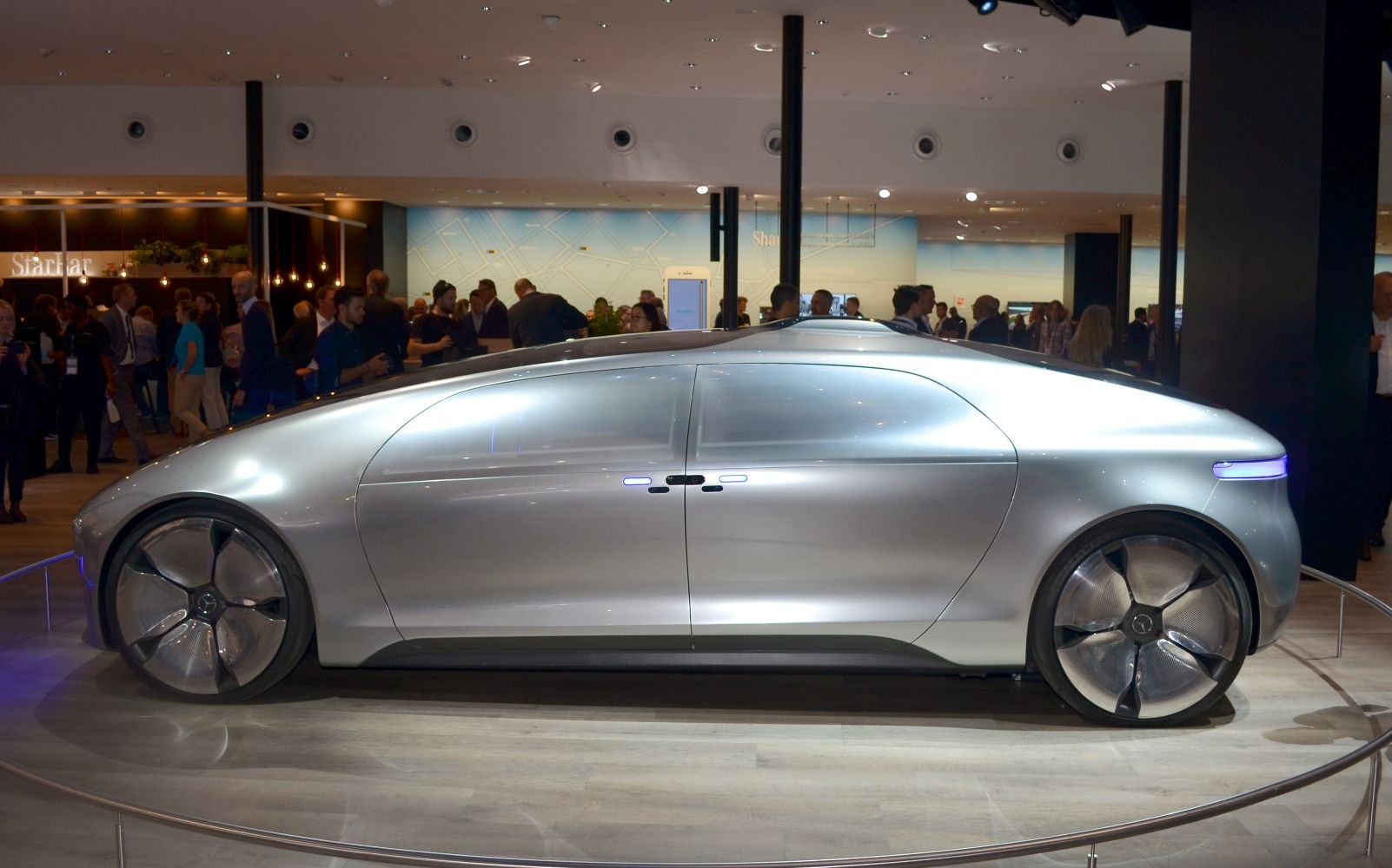 Sleek side profile with futuristic smooth design and large wheels