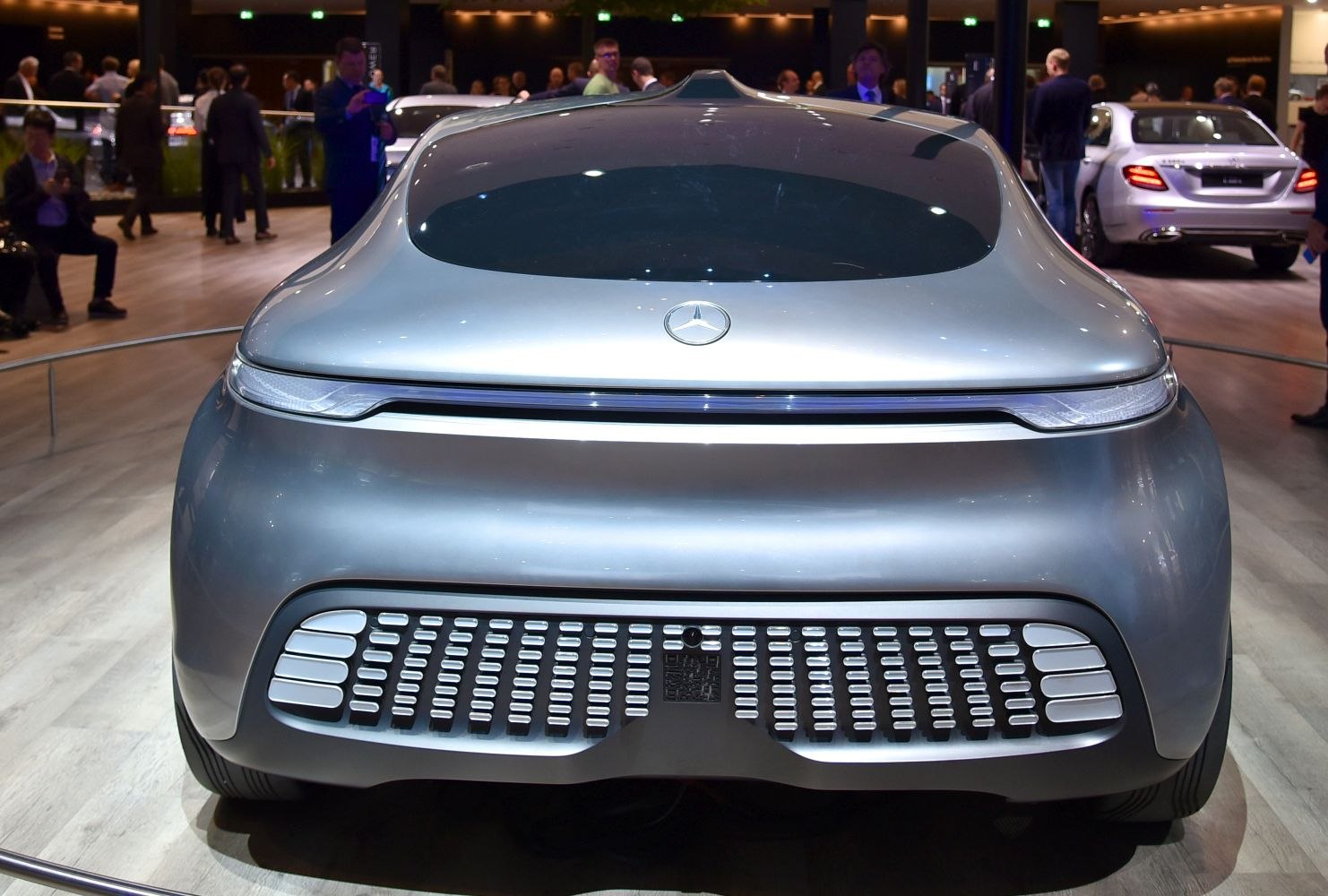 Smooth rear with integrated taillight strip and futuristic design details.