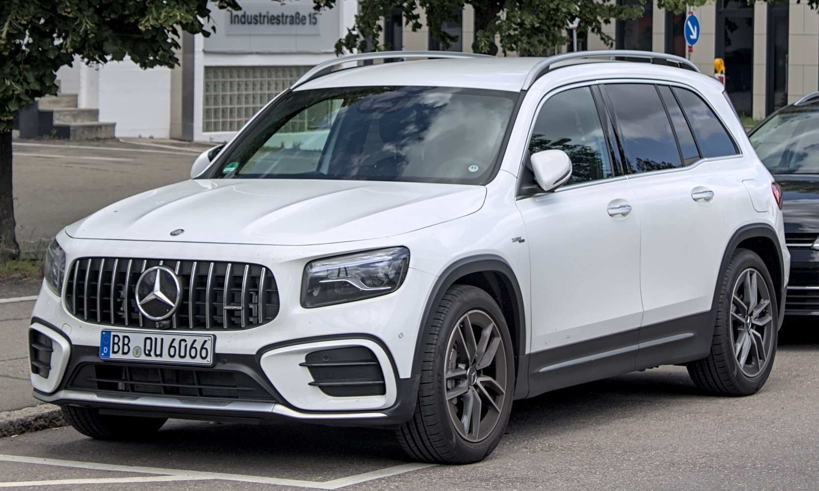 Front and side view with vertical grille and sleek headlights