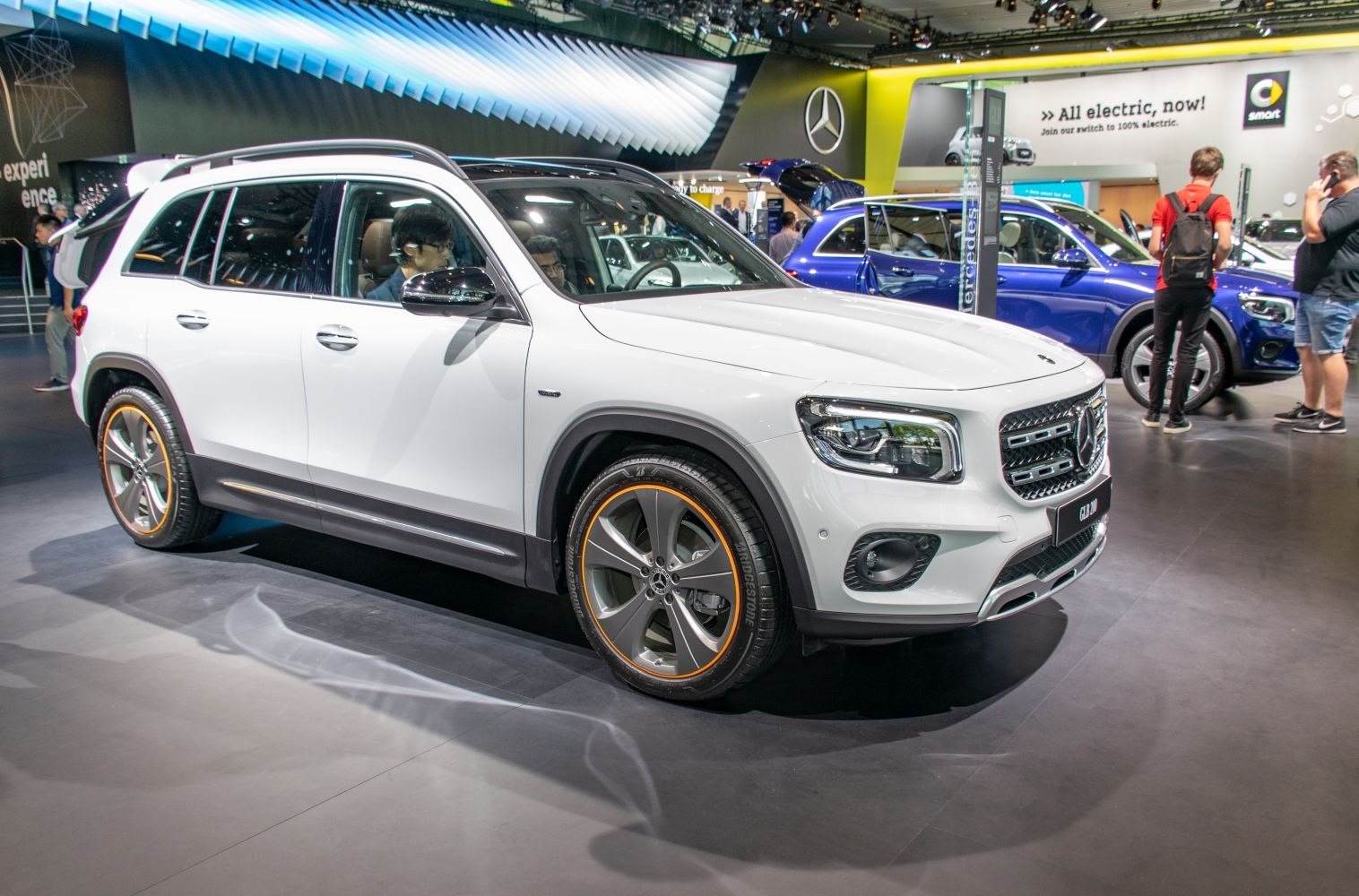 Front-side view of white compact SUV with alloy wheels