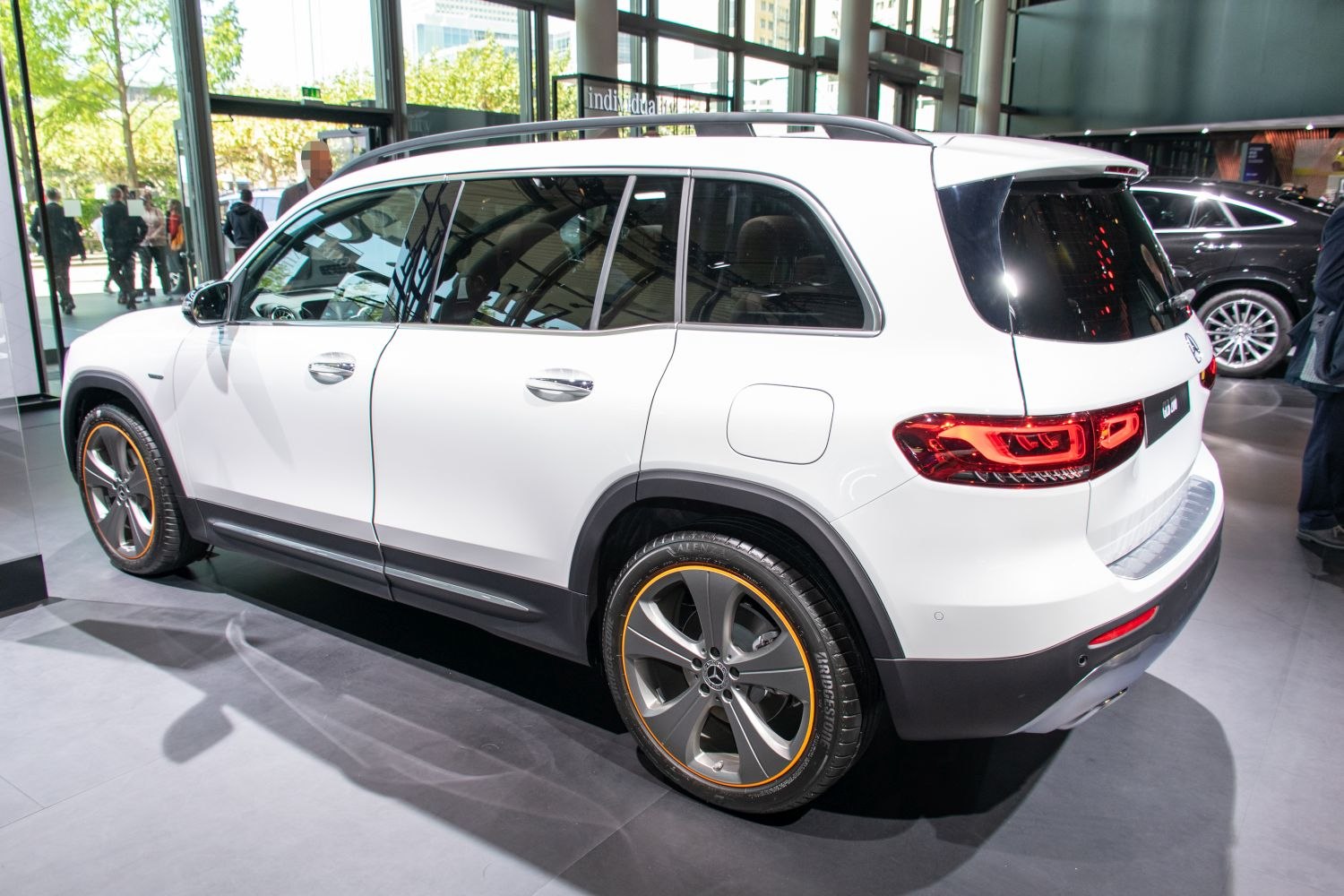 White SUV with orange-trimmed wheels and sleek LED taillights