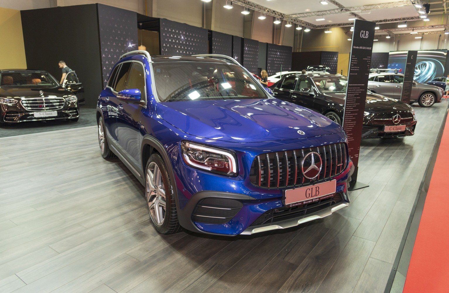 Front of luxury SUV with LED headlights and vertical grille
