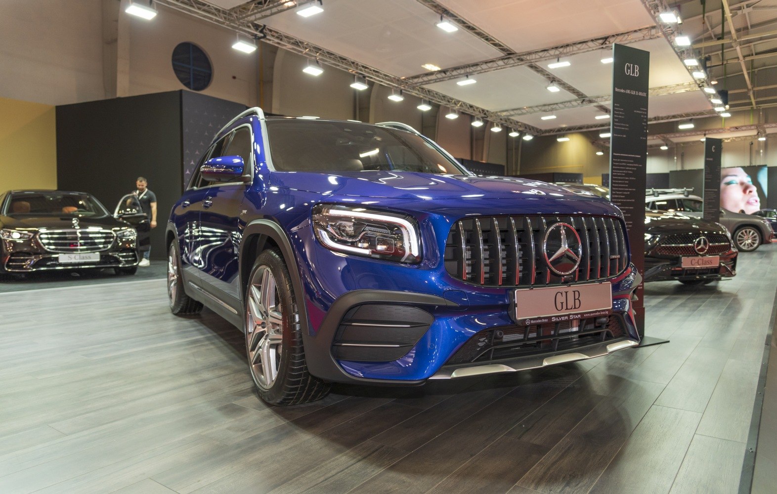 Front view of blue SUV with AMG grille and LED headlights