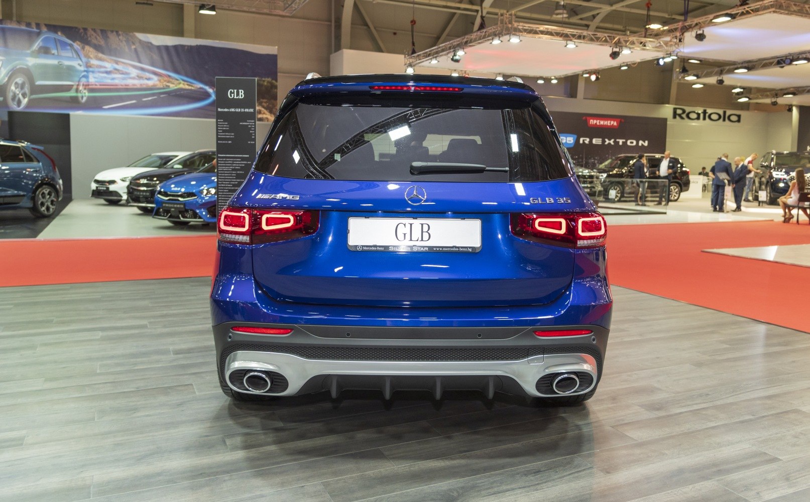 Rear view of SUV with AMG badges, distinct taillights, and dual exhaust pipes