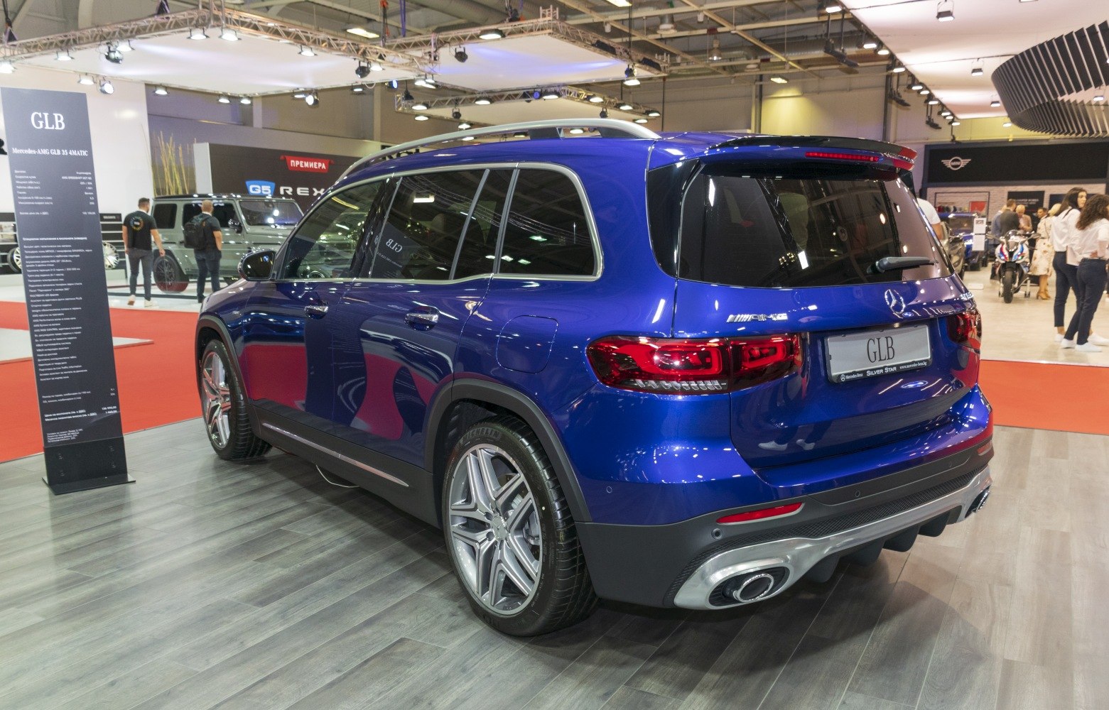 Rear and side view of a luxury SUV with sporty alloy wheels and distinctive taillights