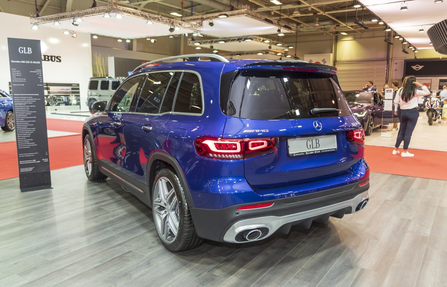 Rear view of blue SUV with LED taillights and AMG styling