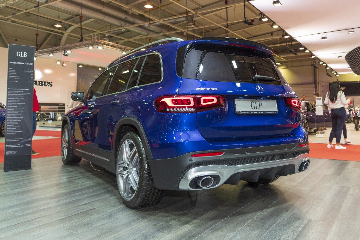 Rear view of a blue SUV with AMG exhaust and LED taillights
