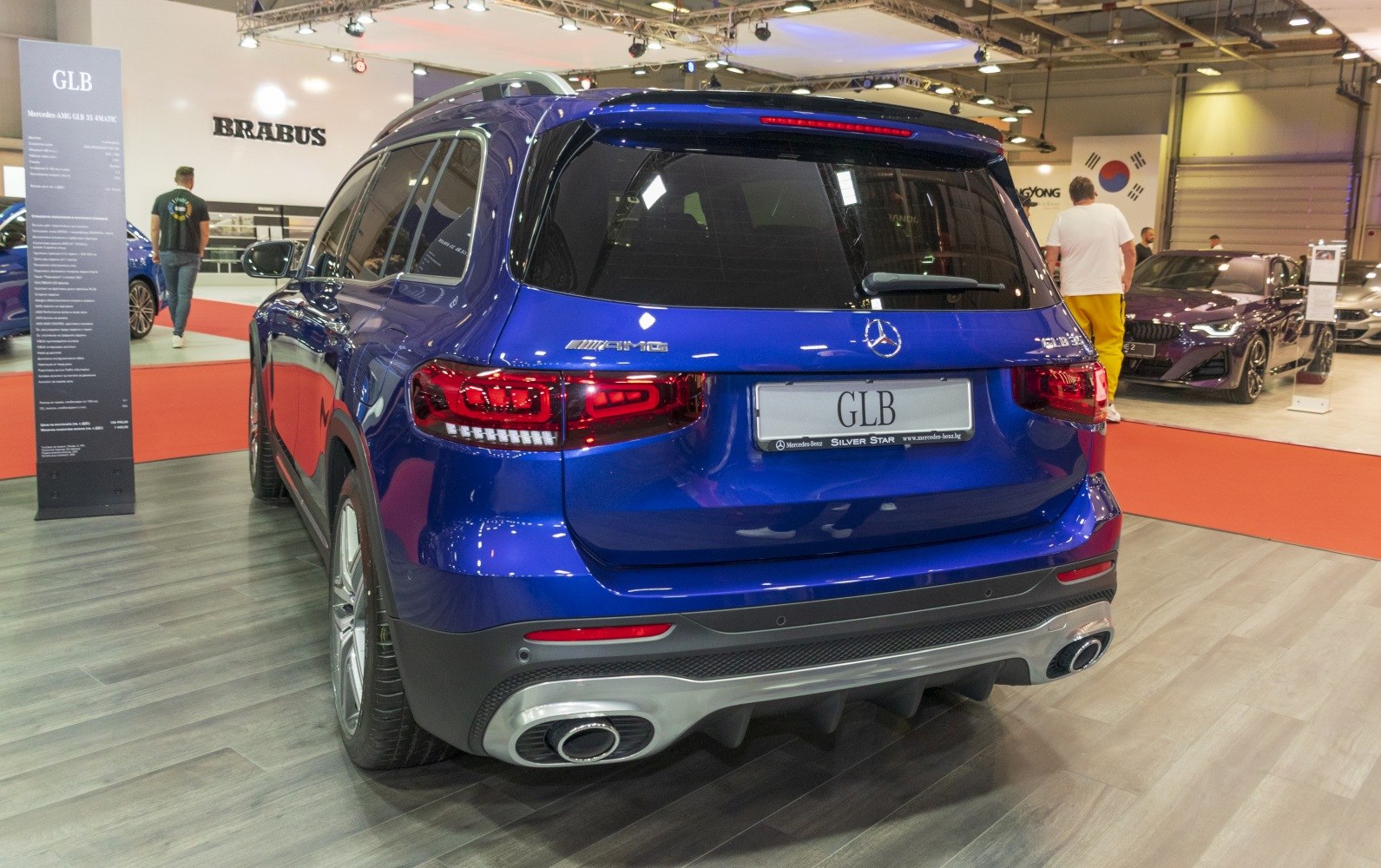 Rear view of a luxury SUV with AMG badges and dual exhausts.