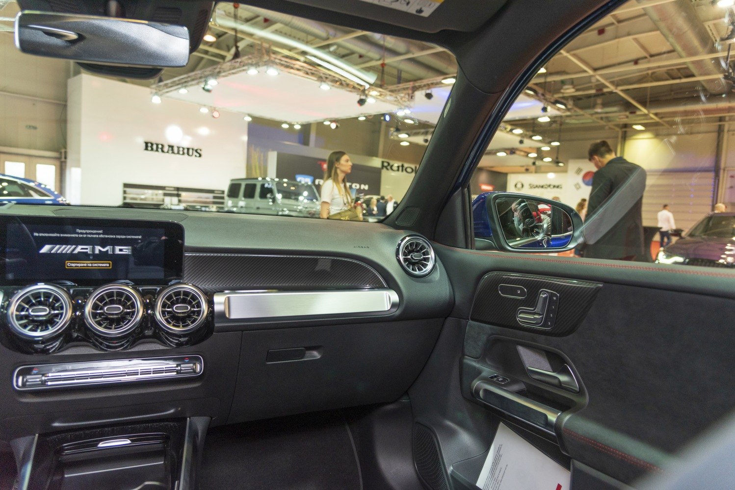 Interior dashboard and door panel with AMG display and air vents