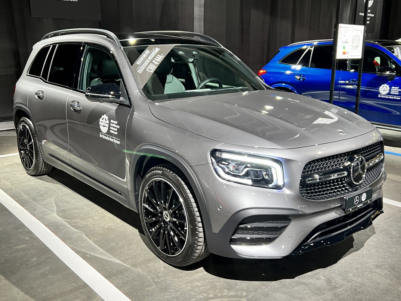 Front three-quarter view of SUV with LED headlights and black wheels