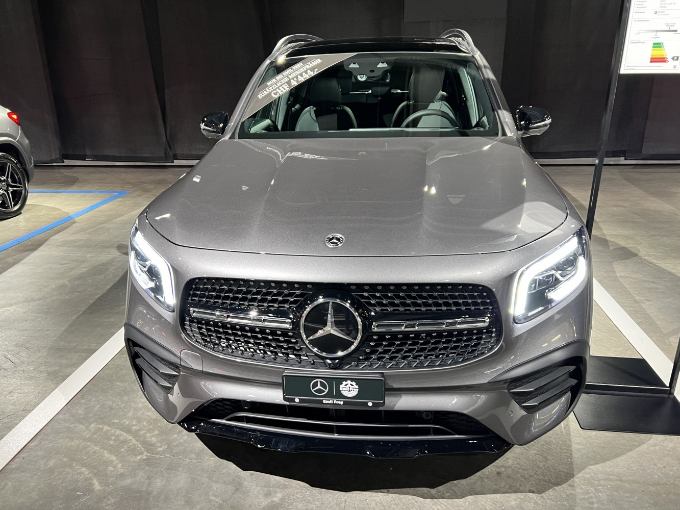 Modern luxury SUV front with LED headlights and bold grille