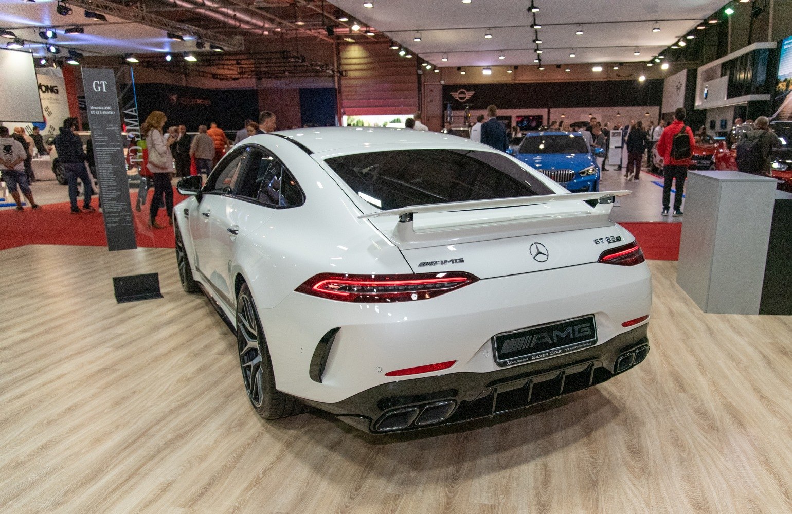 Rear view with prominent spoiler and quad exhaust