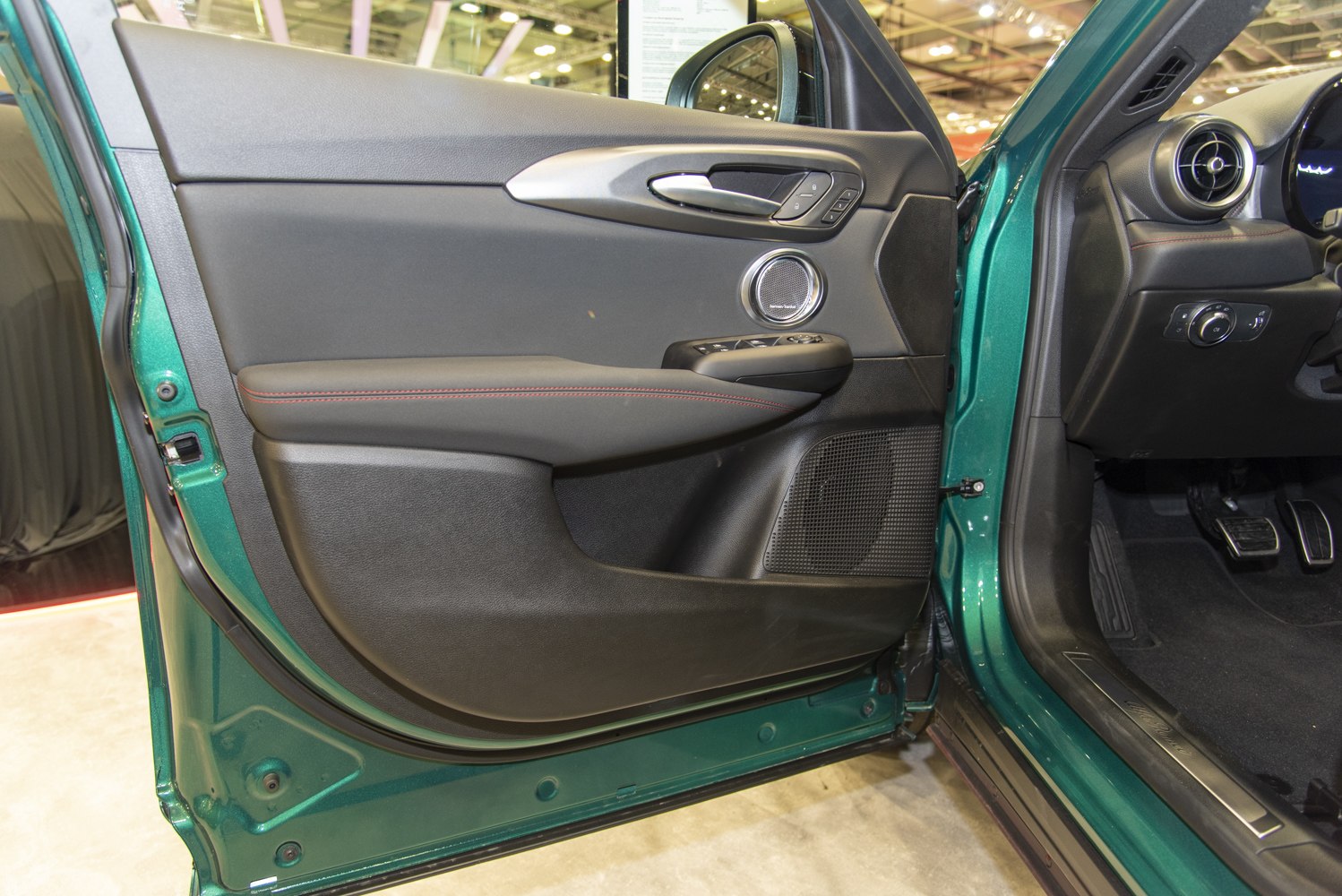Interior door panel with Harman Kardon speaker and window controls