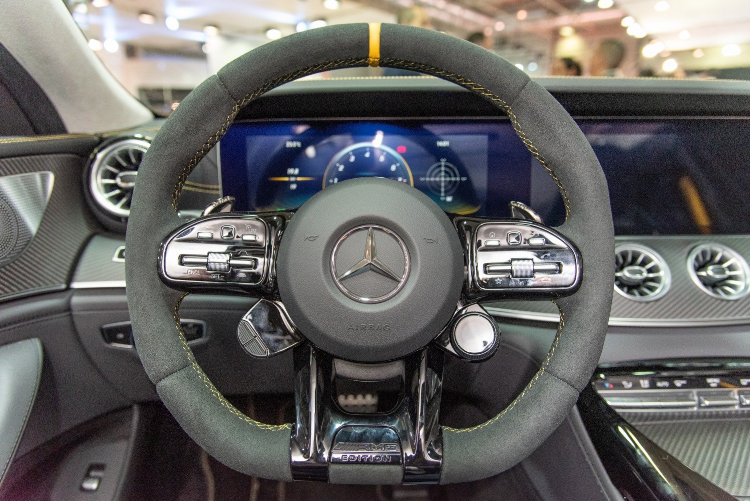 Sport steering wheel with AMG branding and digital dashboard