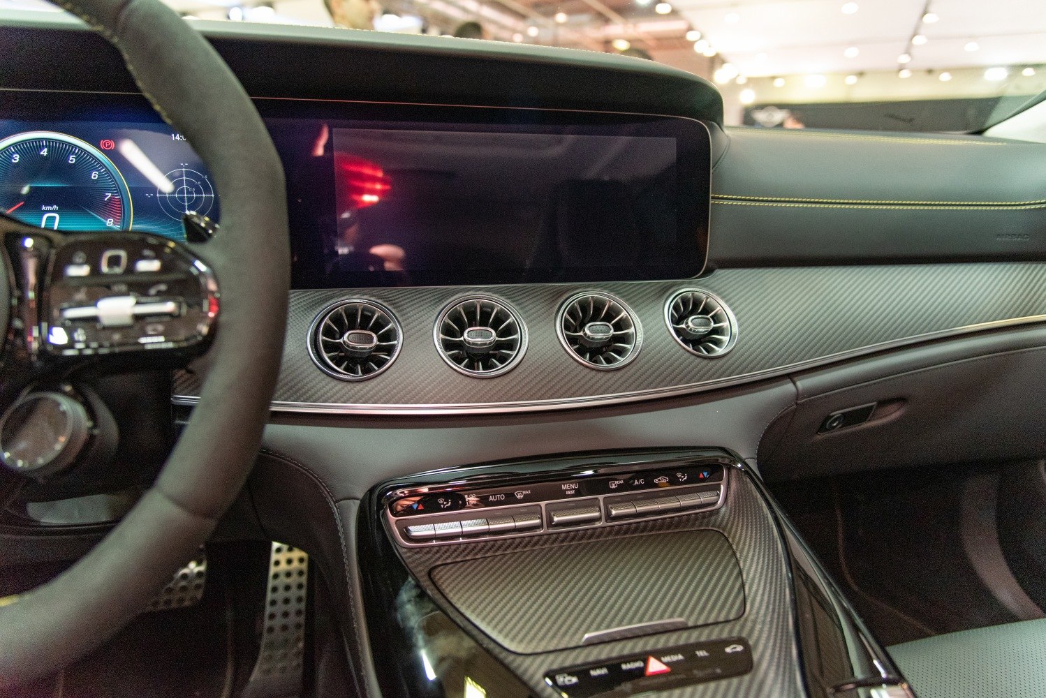 Digital dashboard, round air vents, carbon fiber trim