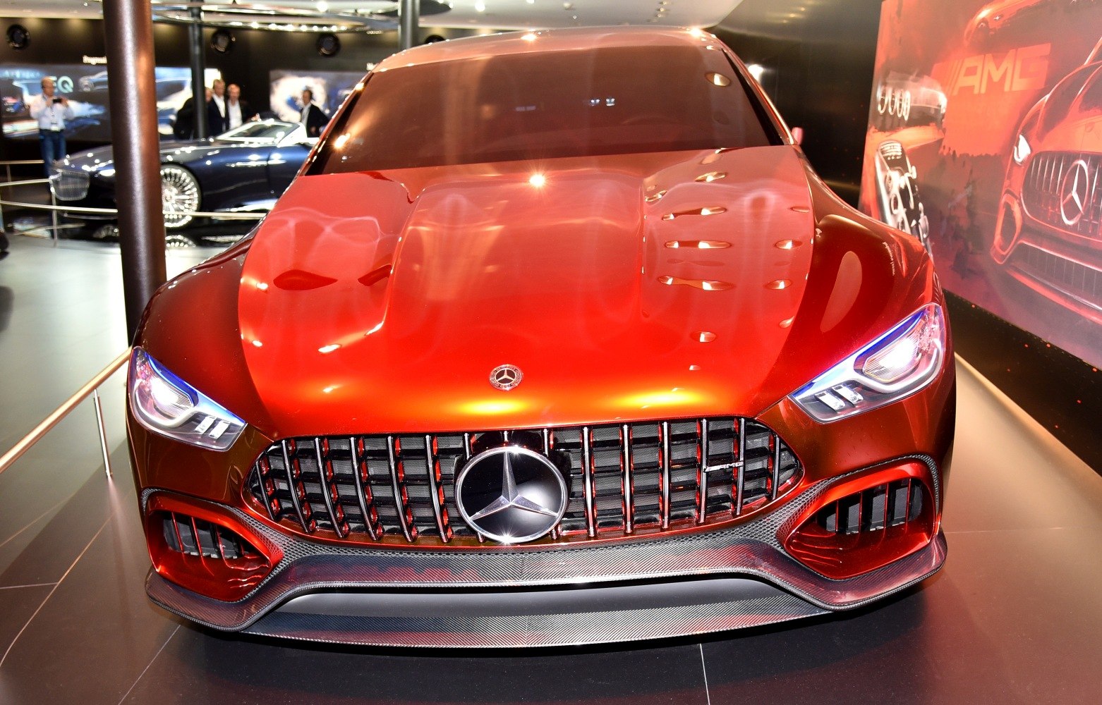 Front view with prominent grille and aggressive headlights.