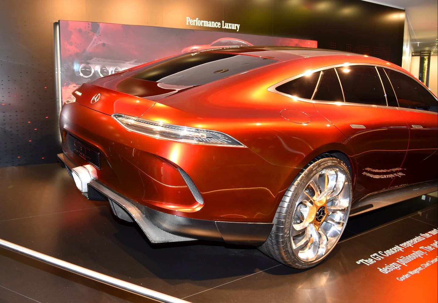Sleek rear end and distinctive polished alloy wheels of a luxury coupe
