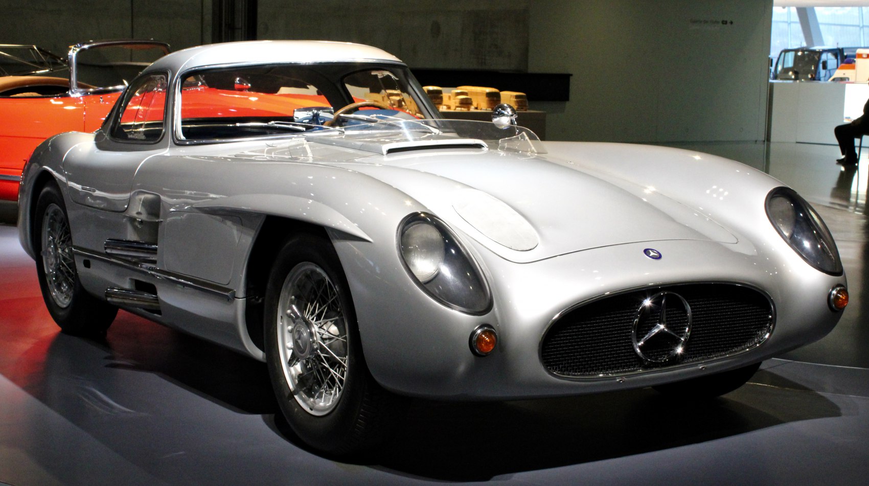 Silver vintage sports coupe with aerodynamic body and wire-spoke wheels