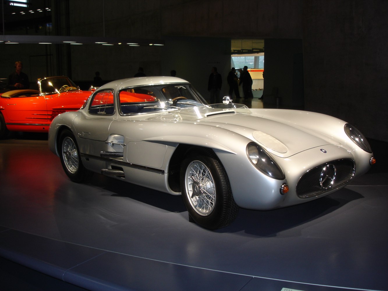 Streamlined vintage coupe with rounded headlights and wire-spoked wheels