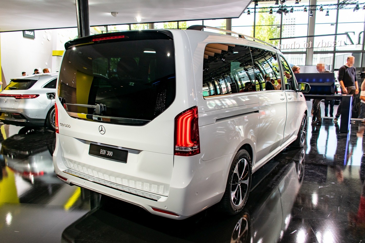 Rear view of electric van with vertical LED taillights and large rear window
