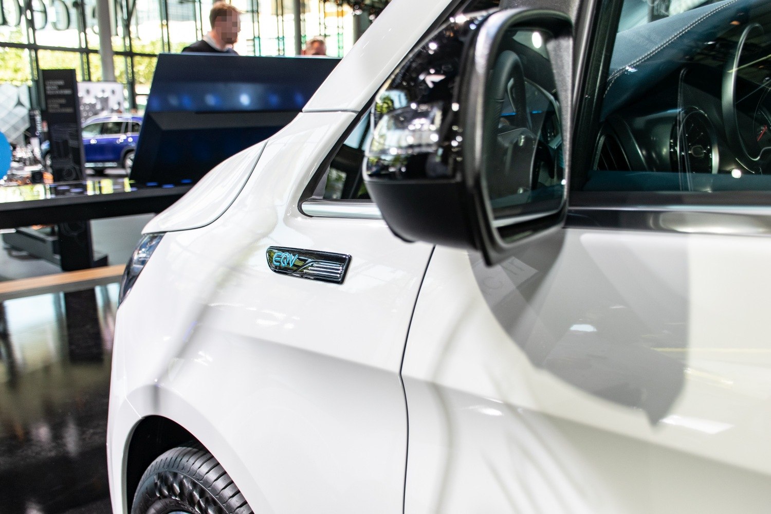 Close-up of electric MPV side emblem and mirror