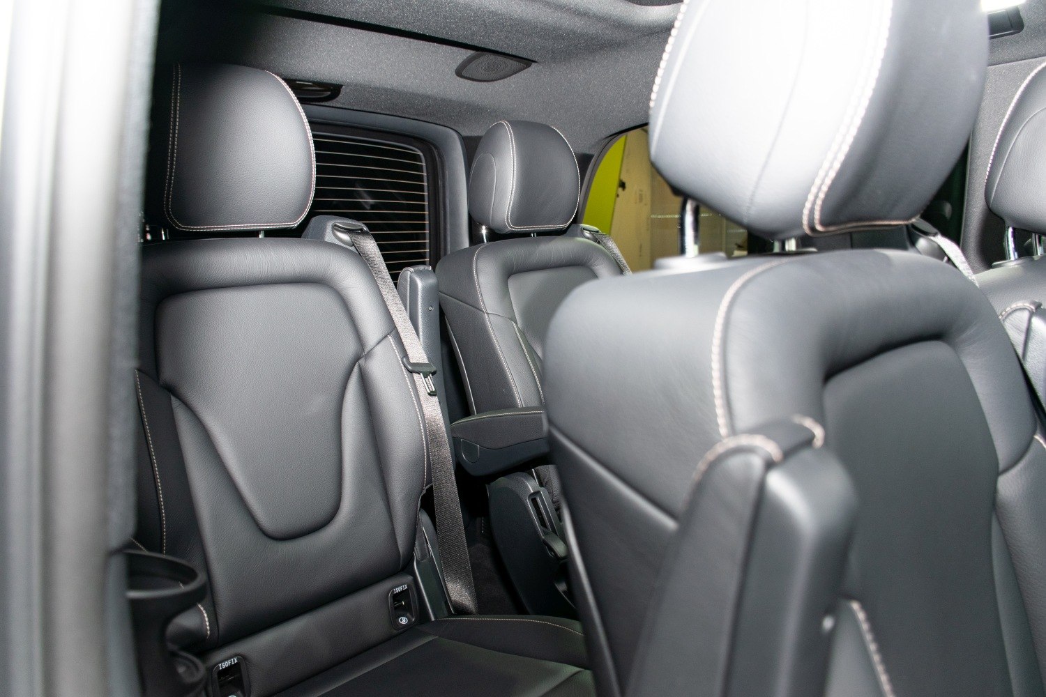 Black leather seats with contrast stitching in luxury vehicle interior