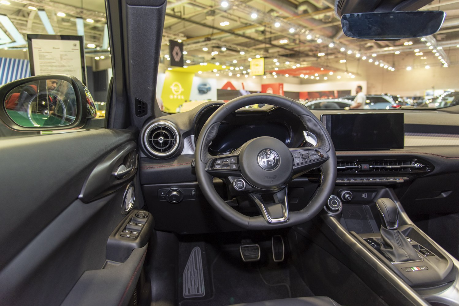 Modern dashboard and multifunction steering wheel in car interior